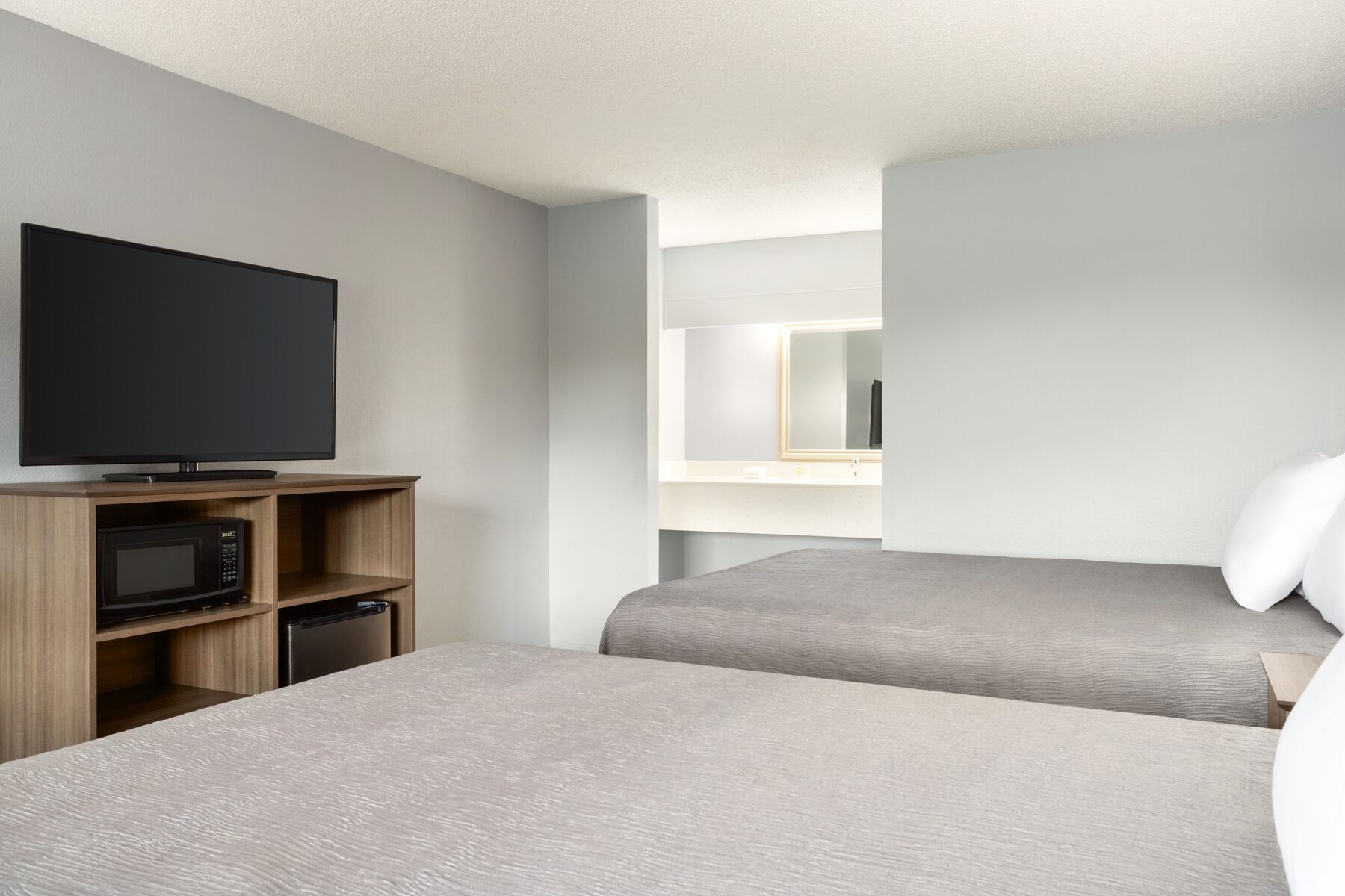 Double queen room for families at Home Inn and Suites Apopka Florida